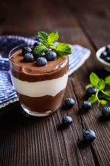 Chocolate and vanilla mascarpone dessert topped with blueberry