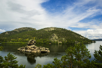 Fototapeta na wymiar Borovoe lake and stone sculprure jumbaktas, Burabay National park in Northern Kazakhstan.