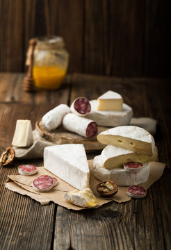 Assorted cheese and salami with honey