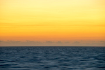 blurry water with a Caribbean sunset