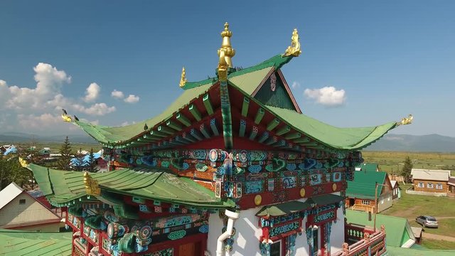 Ivolginsky Datsan Buddhist Monastery Russia Ulan-Ude. Old complex temple  Monument History Architecture. Suburgans Monks Willage. Picturesque cover roof painting. Summer day Aerial Approach close 4k