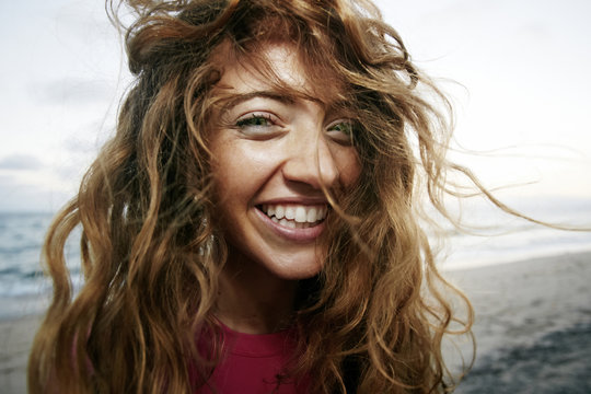 Wind blowing hair of Caucasian woman on beach