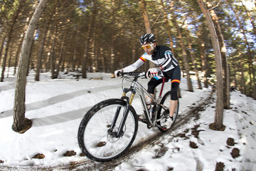 Fototapeta premium Young man riding a mountain bike