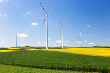 Wind farm with spinning wind turbines