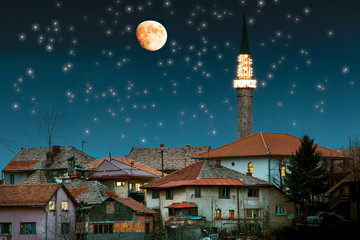 Beautiful mosque with moon on sky background 