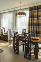 Modern flat interior. Guest room.  Friuts, flowers. Vertical.