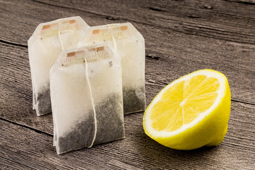 tea bags,sugar and lemon on the wooden table