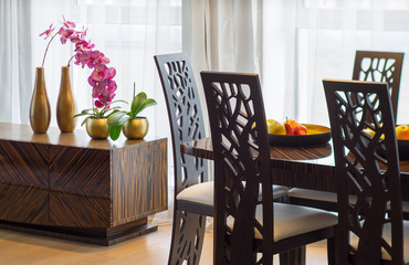 Interior decor with table, flowers and fruits. Modern flat.