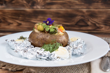 baked potatoes in foil with vegetables