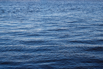 Blue sea water with small waves and sea surface