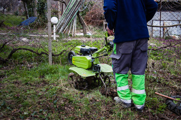 Motor-cultivator at the ploughed kitchen garden.
