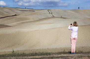 Female Tourist Photographing Landscape
