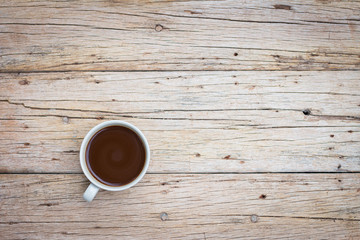 Coffee cup on old wooden