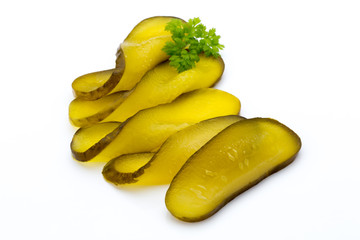 Marinated pickled cucumbers isolated on the white.