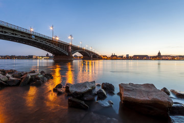 Beautiful sunset over Rhine / Rhein river and old bridge in Mainz near Frankfurt am Main, Germany.