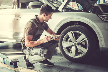 Handsome auto service worker