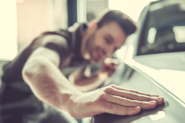 Handsome auto service worker