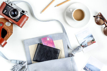 tourist lifestyle with camera and photos white table background top view