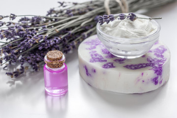 Obraz na płótnie Canvas natural herb cosmetic with lavender flowers flatlay on white background