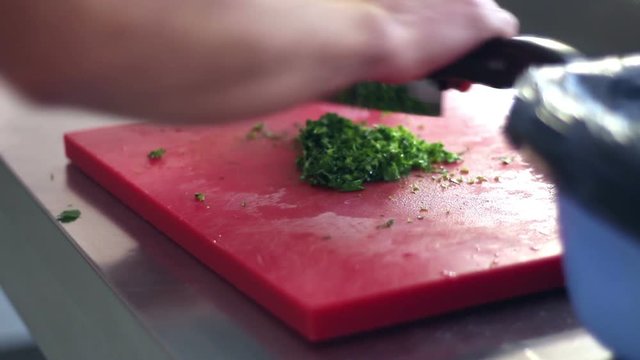 Close up shot of kitchener chopping grocery 
