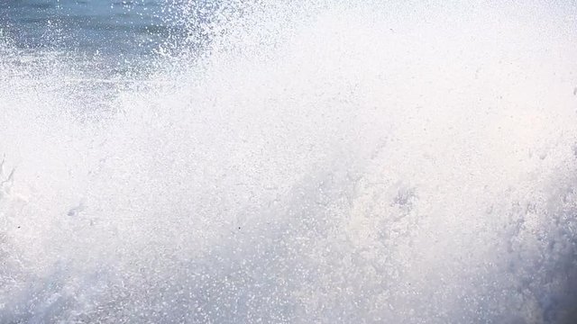 Sea storm, huge waves of foaming are broken against stones