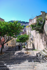 Steep rustic stairs of Lisbon descending to the city center