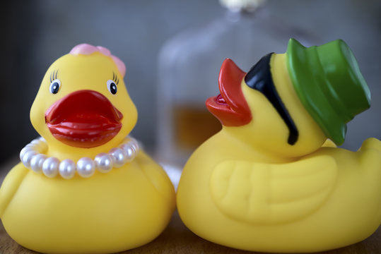 Female and male duck with pearls and parfume