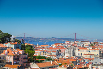 Fototapeta na wymiar Aerial view of Lisbon from famous viewpoint with April 25 Bridge in the background