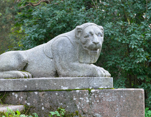 The old granite statue of a lion