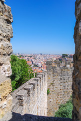 Fototapeta na wymiar View of Lisbon through ancient fortress portal