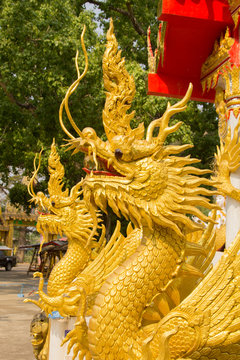 Beautiful gold dragon statue at Wat Mai Kham Wan temple, Phichit,Thailand.