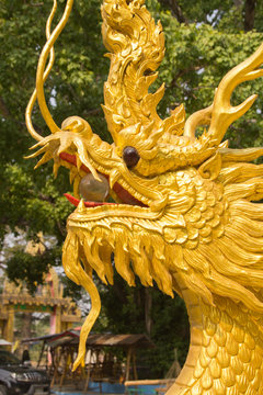 Beautiful gold dragon statue at Wat Mai Kham Wan temple, Phichit,Thailand.