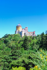 Pena palace fairytale castle rising above the forest in Sintra, Portugal