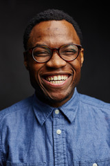 attractive young black male studio dramatic lighting laughing