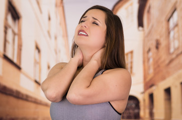 Beautiful lady getting crazy of neck pain