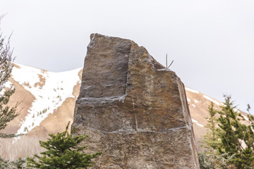 Fototapeta na wymiar Angular Stone in Wintry Mountains