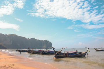 Beautiful Beach with the famous local boat as a main transport in Ao Nang, Krabi THAILAND.