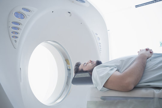 Male patient entering in CT scanner machine