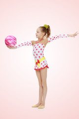 Gymnast does exercises with a ball
