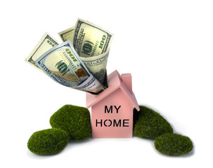 My Home. Insurance. Real estate concept, Picture of a pink wooden house with money of one hundred dollar bills  in a roof