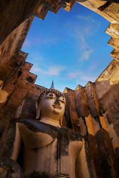 Seated Buddha image at  Wat Si Chum temple in Sukhothai Historical Park, a UNESCO world heritage site, Thailand