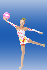 Gymnast does exercises with a ball