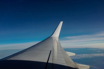 Sunrise view at the window of aircraft.