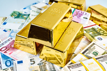 Investment in gold.Money and Gold. gold bullions. Financial concept