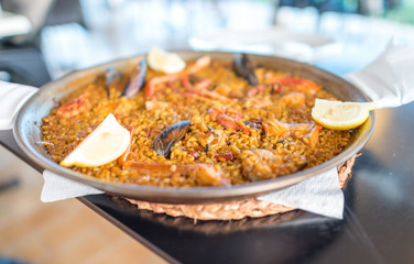Paella served on a big plate, Spain