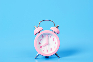 Vintage pink alarm clock.