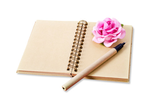 Open blank brown diary with pen and pink rose.