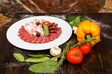 Dish with sliced meat products