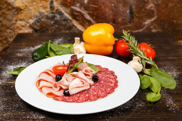 Dish with sliced meat products