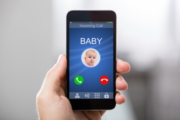 Hand Holding Cell Phone With Blank Screen